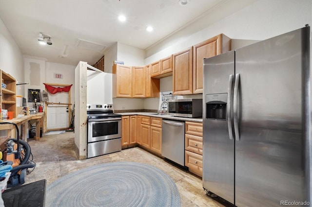 kitchen featuring sink, stainless steel appliances, and light brown cabinetry