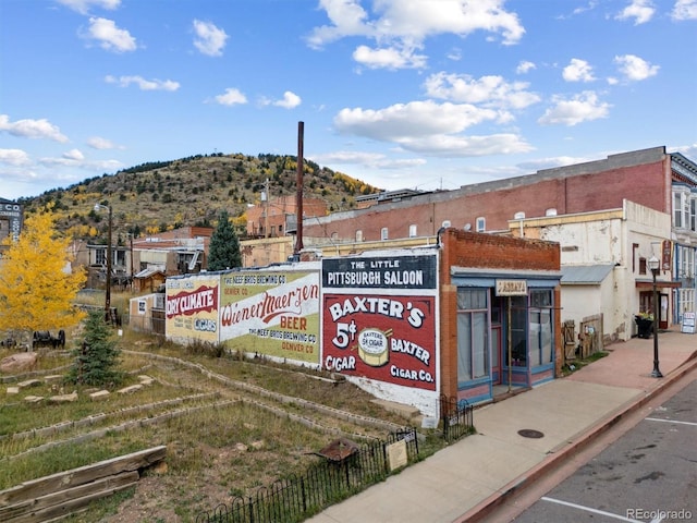 view of building exterior featuring a mountain view