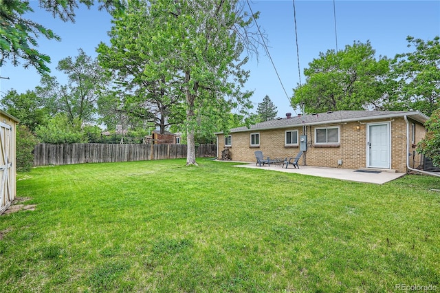 view of yard featuring a patio and a fenced backyard