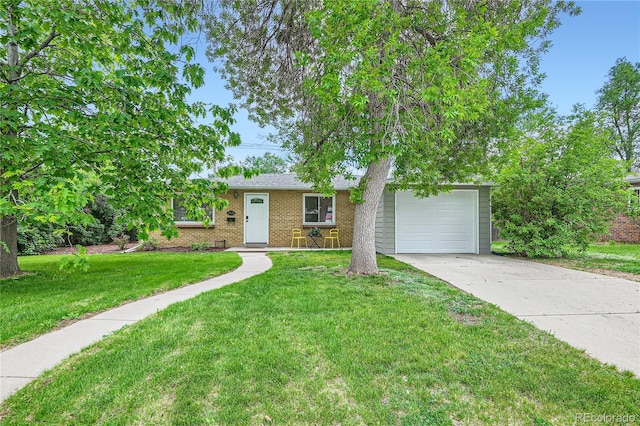 ranch-style house featuring a garage, driveway, brick siding, and a front yard