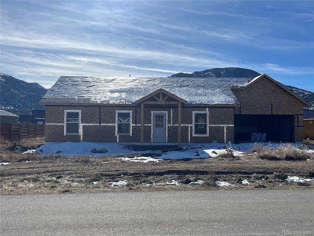 view of front of property with a mountain view