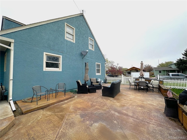 495 E Ave, Limon, CO 80828 - view of patio featuring an outdoor living space and fence