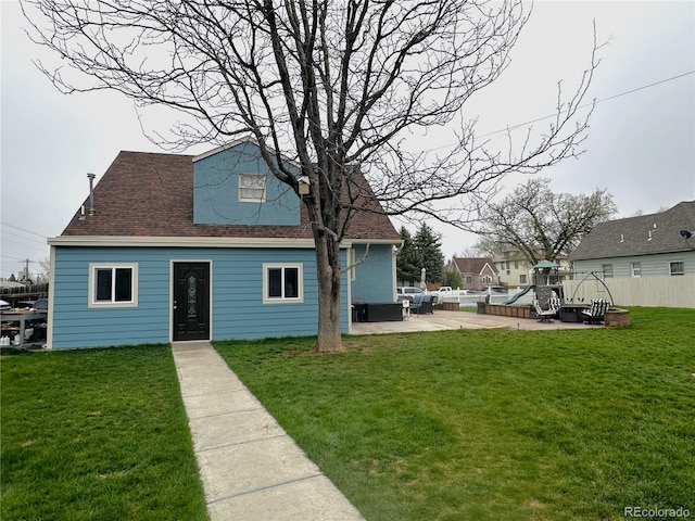 495 E Ave, Limon, CO 80828 - back of property featuring a playground, a patio area, and roof with shingles
