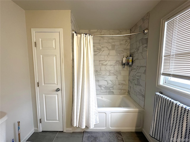 495 E Ave, Limon, CO 80828 - bathroom featuring radiator heating unit, shower / tub combo, tile patterned floors, and baseboards