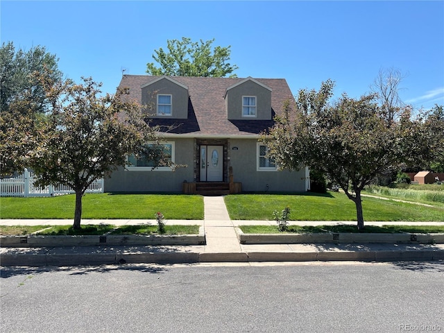 495 E Ave, Limon, CO 80828 - view of front facade featuring stucco siding and roof with shingles