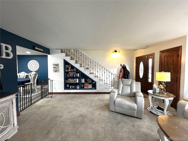 495 E Ave, Limon, CO 80828 - carpeted living room featuring stairs and baseboards