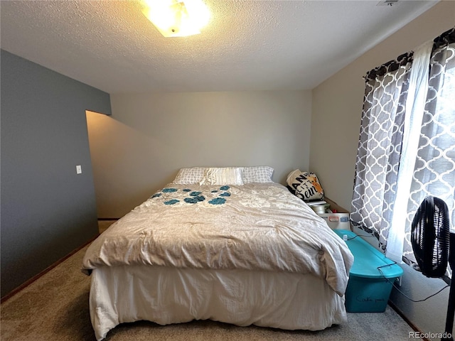 495 E Ave, Limon, CO 80828 - carpeted bedroom featuring a textured ceiling