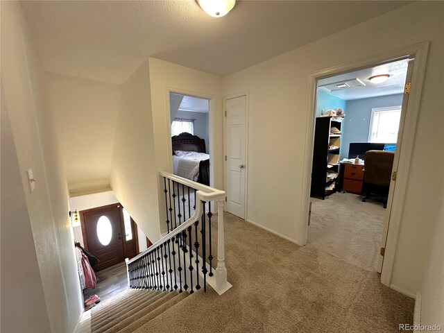 495 E Ave, Limon, CO 80828 - hall featuring carpet floors, an office area, and an upstairs landing
