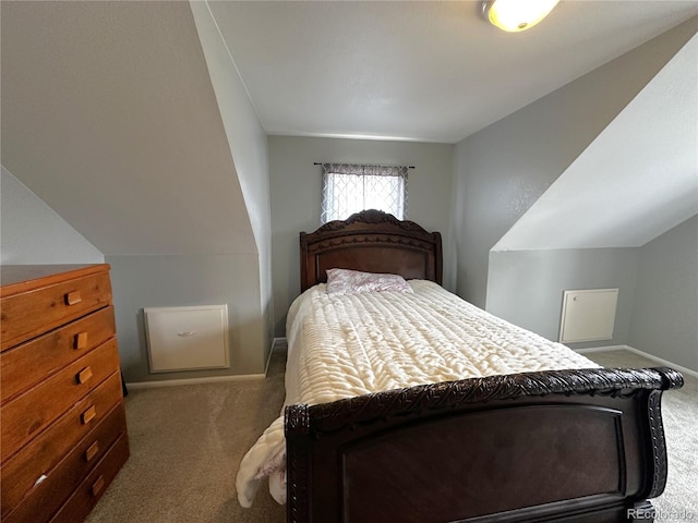 495 E Ave, Limon, CO 80828 - carpeted bedroom featuring baseboards and vaulted ceiling