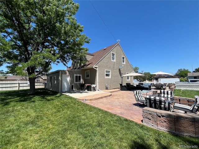 495 E Ave, Limon, CO 80828 - back of property with an outdoor living space, a patio, and stucco siding