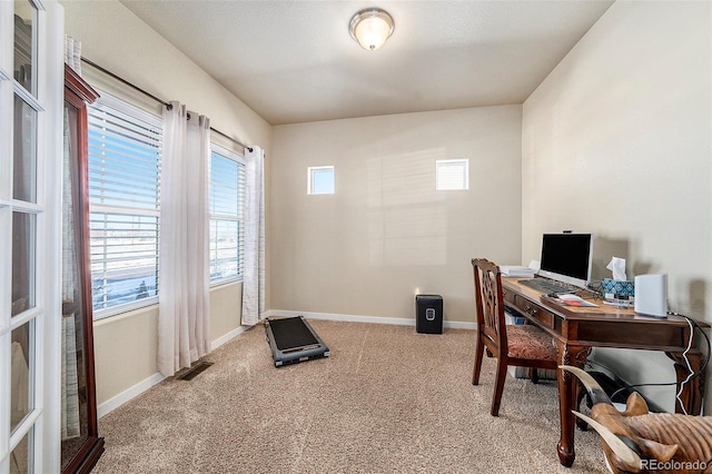 office with light carpet, baseboards, and visible vents