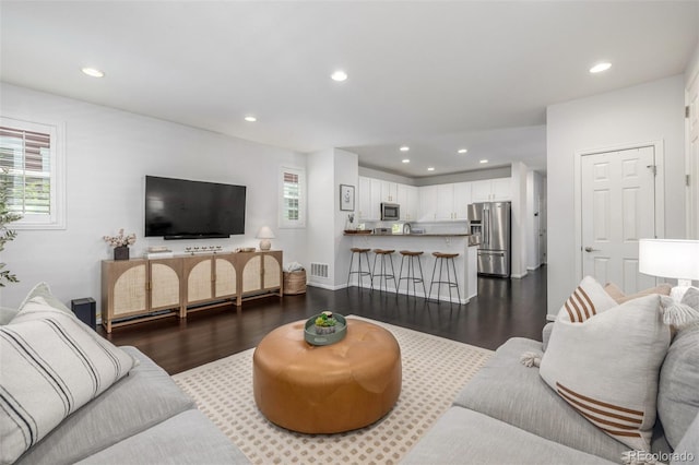 3433 N Wabash St, Denver, CO 80238 - living area with dark wood-style flooring, recessed lighting, and plenty of natural light
