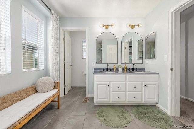 3433 N Wabash St, Denver, CO 80238 - full bathroom with double vanity and tile patterned floors