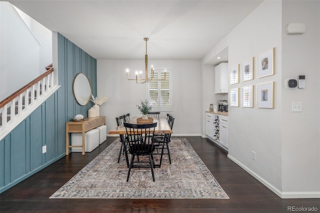 3433 N Wabash St, Denver, CO 80238 - dining area featuring a chandelier, dark wood-style flooring, and stairs