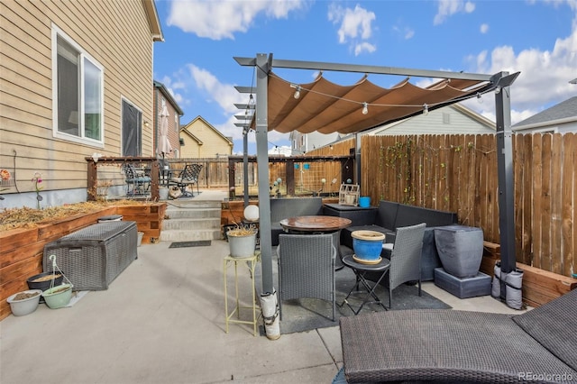 view of patio / terrace featuring fence and outdoor dining area