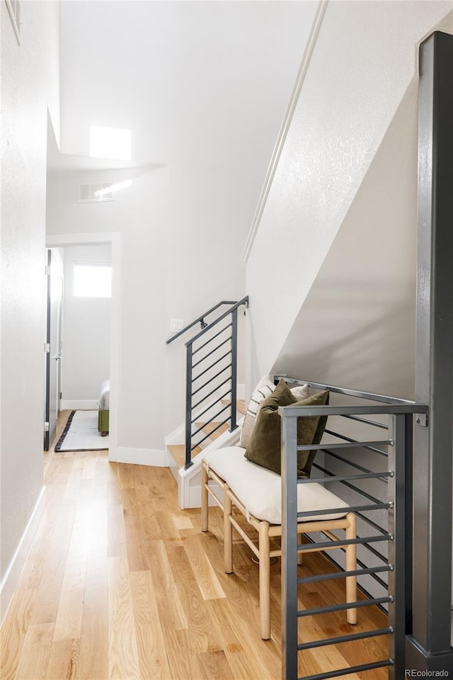 stairs with hardwood / wood-style floors