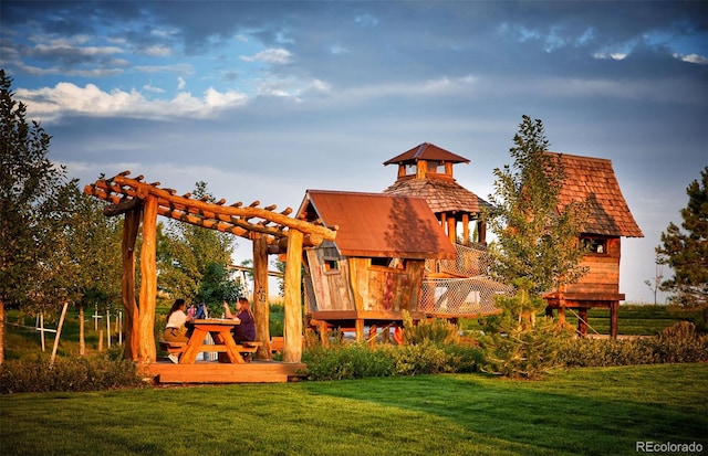 6322 N Malaya St, Aurora, CO 80019 - view of jungle gym featuring a lawn