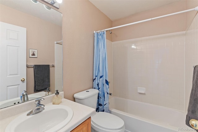 bathroom featuring toilet, shower / bath combo with shower curtain, and vanity