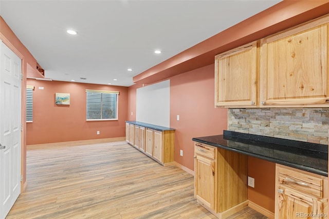 kitchen featuring light brown cabinets, light wood-type flooring, recessed lighting, decorative backsplash, and baseboards