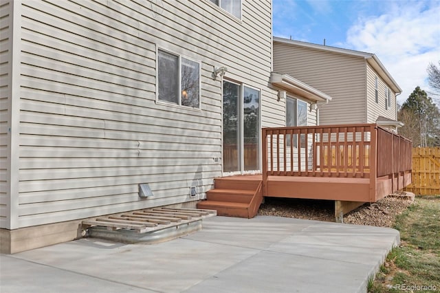 wooden deck featuring a patio area and fence