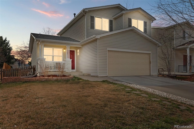 view of front of home featuring concrete driveway and a porch
