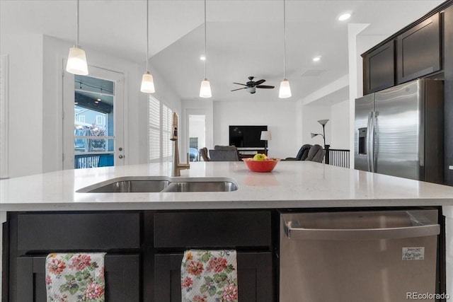 5045 Preserve Pl, Firestone, CO 80504 - kitchen with stainless steel appliances, open floor plan, hanging light fixtures, light stone counters, and ceiling fan