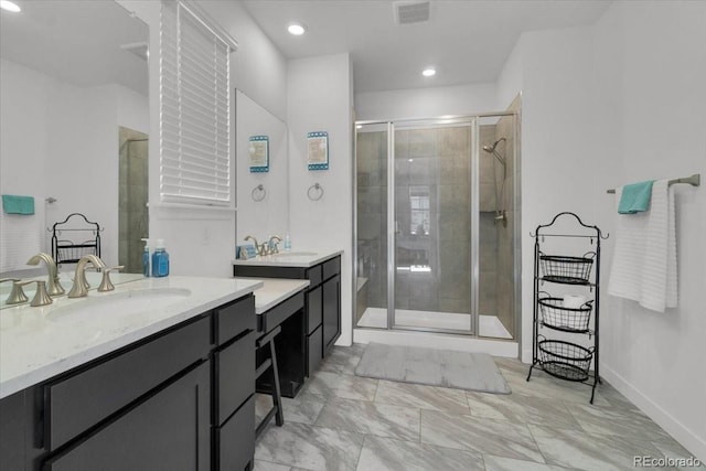 5045 Preserve Pl, Firestone, CO 80504 - full bath featuring a shower stall, two vanities, marble finish flooring, and recessed lighting
