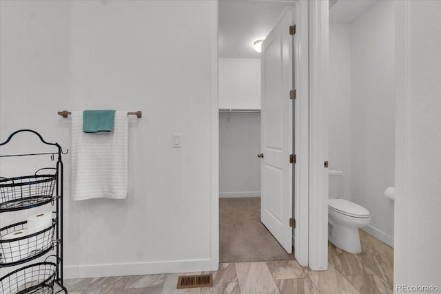 5045 Preserve Pl, Firestone, CO 80504 - bathroom with toilet and baseboards