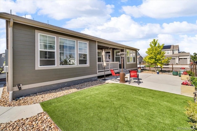 5045 Preserve Pl, Firestone, CO 80504 - back of property with a patio area and a yard