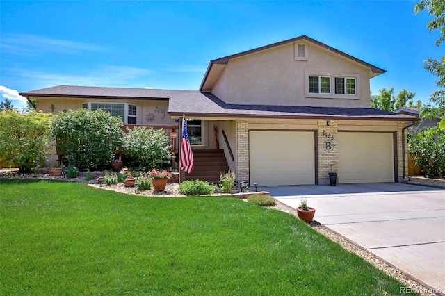 tri-level home featuring a garage and a front lawn