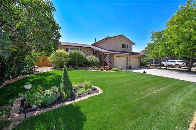 view of front facade with a front yard and a garage