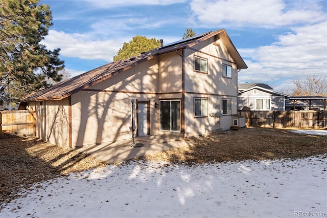 view of snow covered house