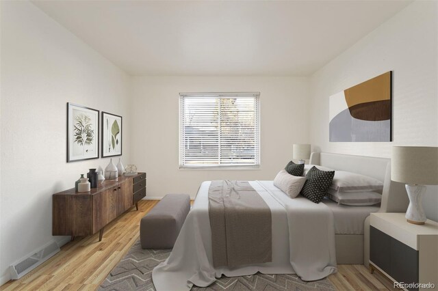 bedroom with light hardwood / wood-style flooring