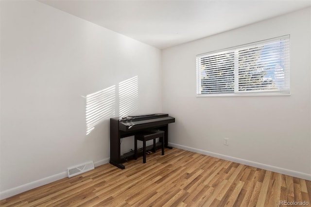 empty room with light hardwood / wood-style floors