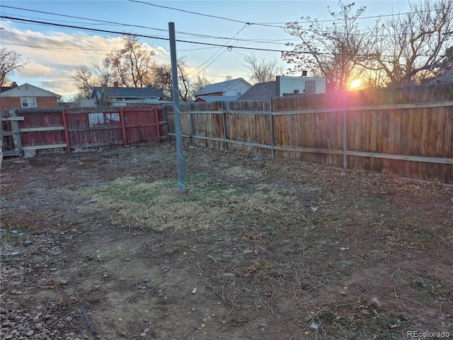 view of yard at dusk