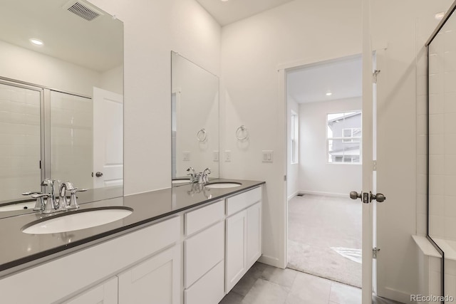 full bathroom featuring a sink, tile patterned flooring, double vanity, and visible vents