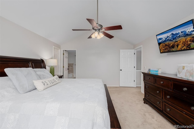 bedroom with light colored carpet, vaulted ceiling, baseboards, and ceiling fan