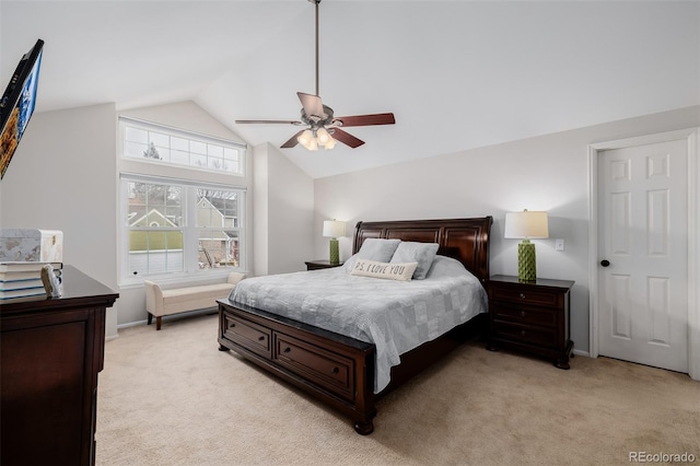 bedroom featuring a ceiling fan, light colored carpet, and vaulted ceiling