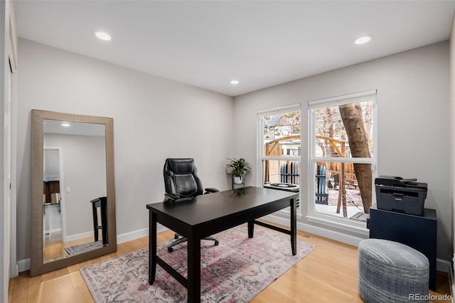 office space with light wood-style floors, baseboards, and recessed lighting