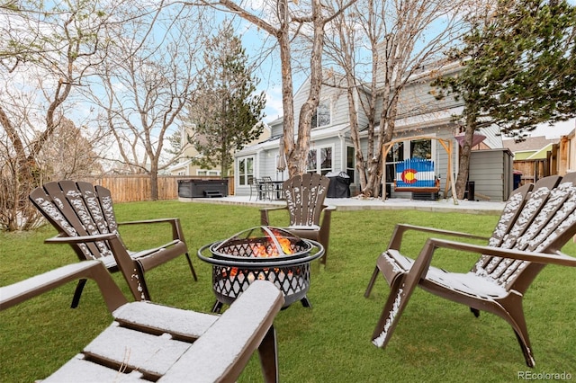 view of yard with a fire pit, a patio, fence private yard, and a hot tub