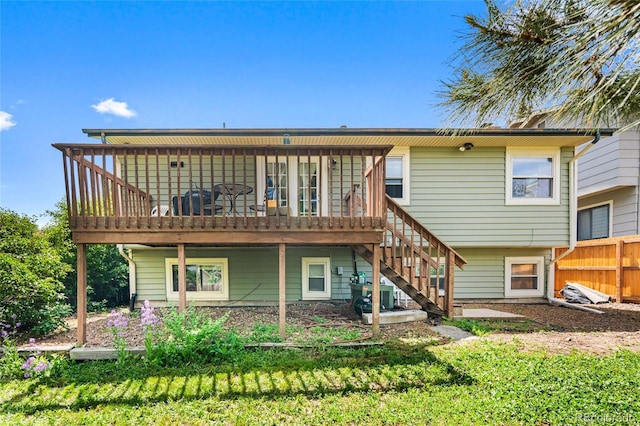 18771 Mexico Dr E, Aurora, CO 80017 - back of house with a deck, stairway, and central AC unit