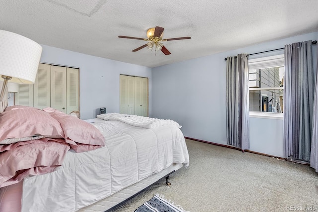 18771 Mexico Dr E, Aurora, CO 80017 - carpeted bedroom featuring multiple closets, a textured ceiling, a ceiling fan, and baseboards