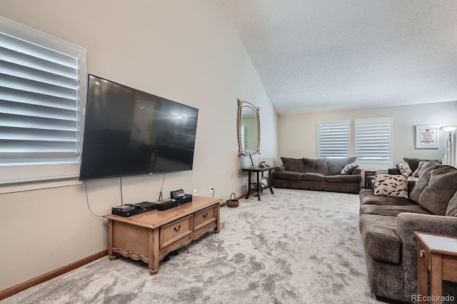 living room featuring carpet flooring, vaulted ceiling, and a textured ceiling