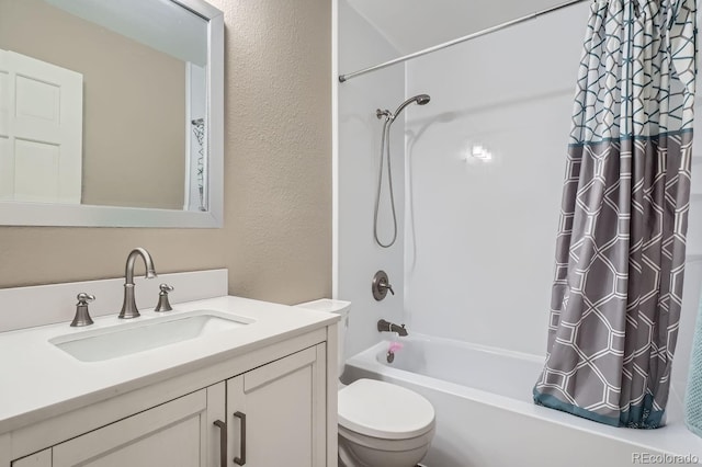 full bathroom featuring vanity, shower / tub combo, and toilet