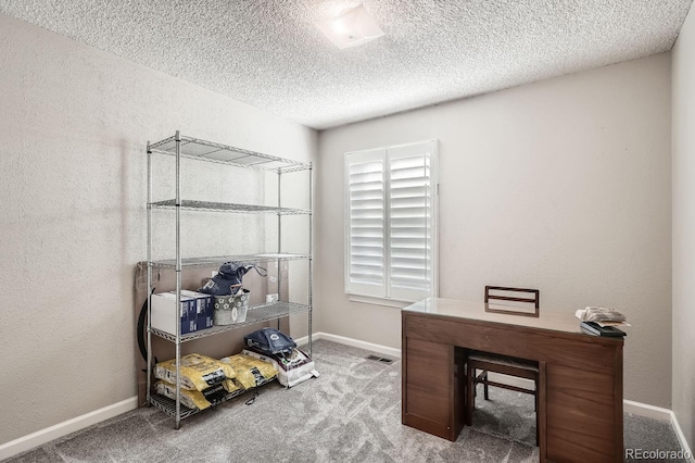 office space with carpet and a textured ceiling