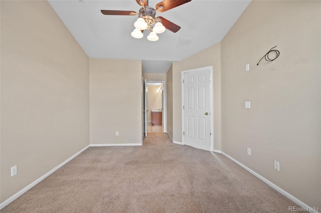 unfurnished room with ceiling fan and light colored carpet