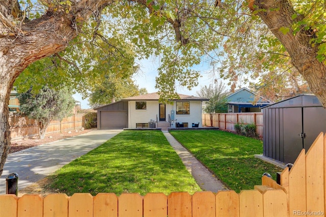 view of front of home with a garage, a shed, and a front yard