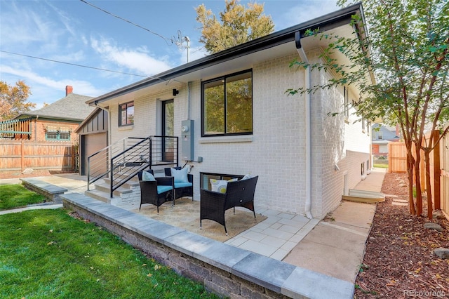 rear view of house featuring a patio