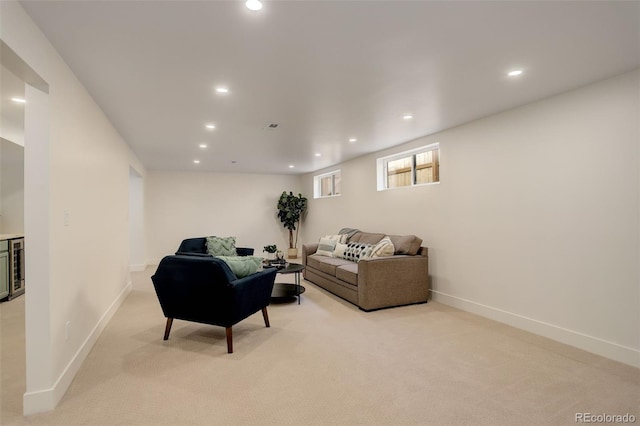 living room featuring light colored carpet and beverage cooler