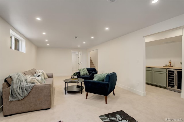 carpeted living room featuring beverage cooler